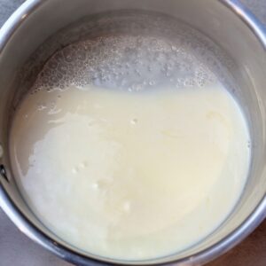Heated 35% whipping cream with honey to make dark chocolate whipped ganache